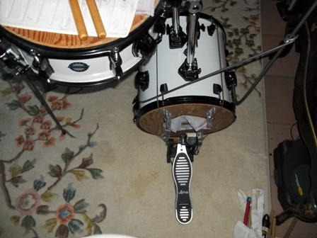My bass drum pedal. I use the same type of pedal on my arena-rock cocktail kit but I got a second one on E-bay for $35 so I wouldn't have to re-adjust it constantly. I hold my kick drum mute on with those TINY bungee cords.